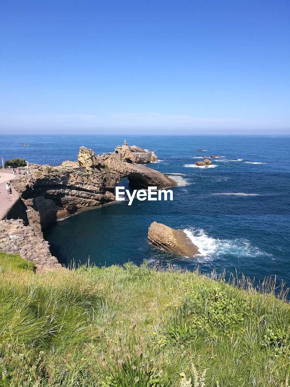 Scenic view of sea against clear blue sky