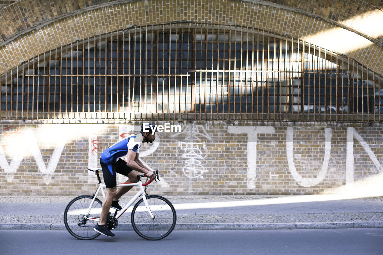 Young man riding bicycle in the city