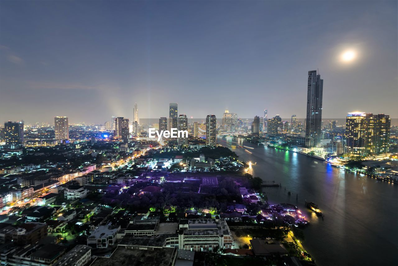 High angle view of illuminated buildings in city at night