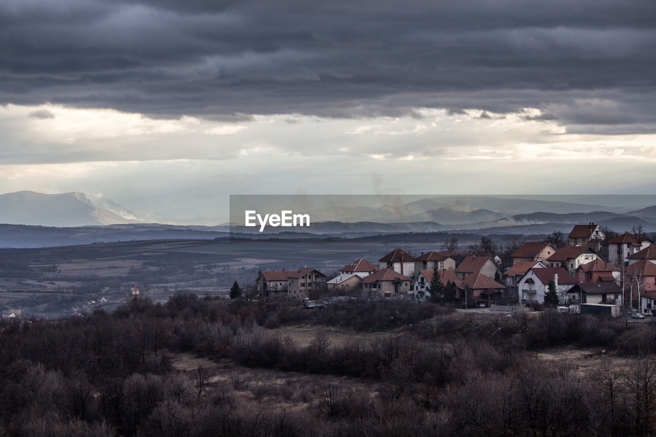 Houses and townscape against sky