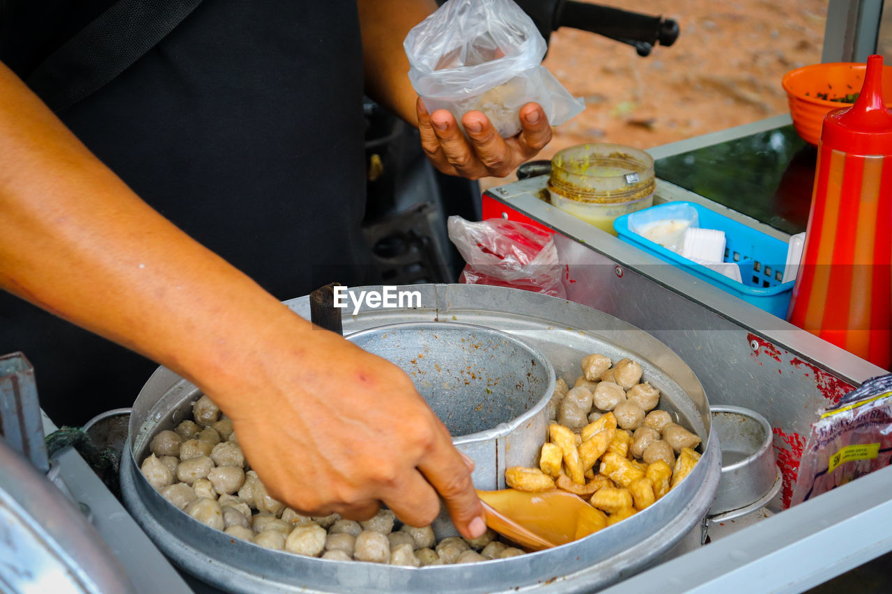 Street food that is sold by way of using a motor that is modified with a pan