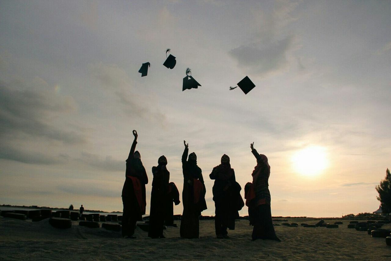 SILHOUETTE OF PEOPLE AT SUNSET