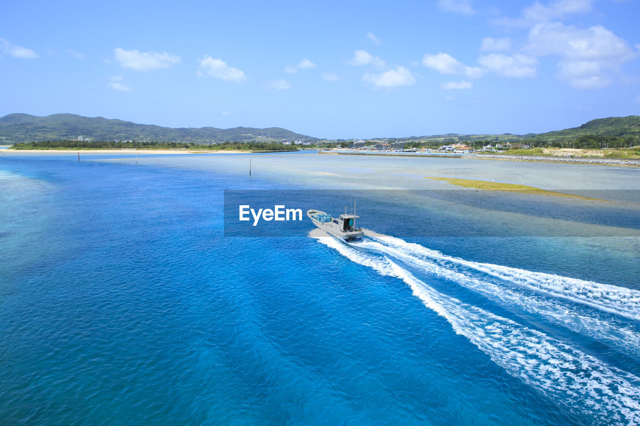 Scenic view of sea against blue sky