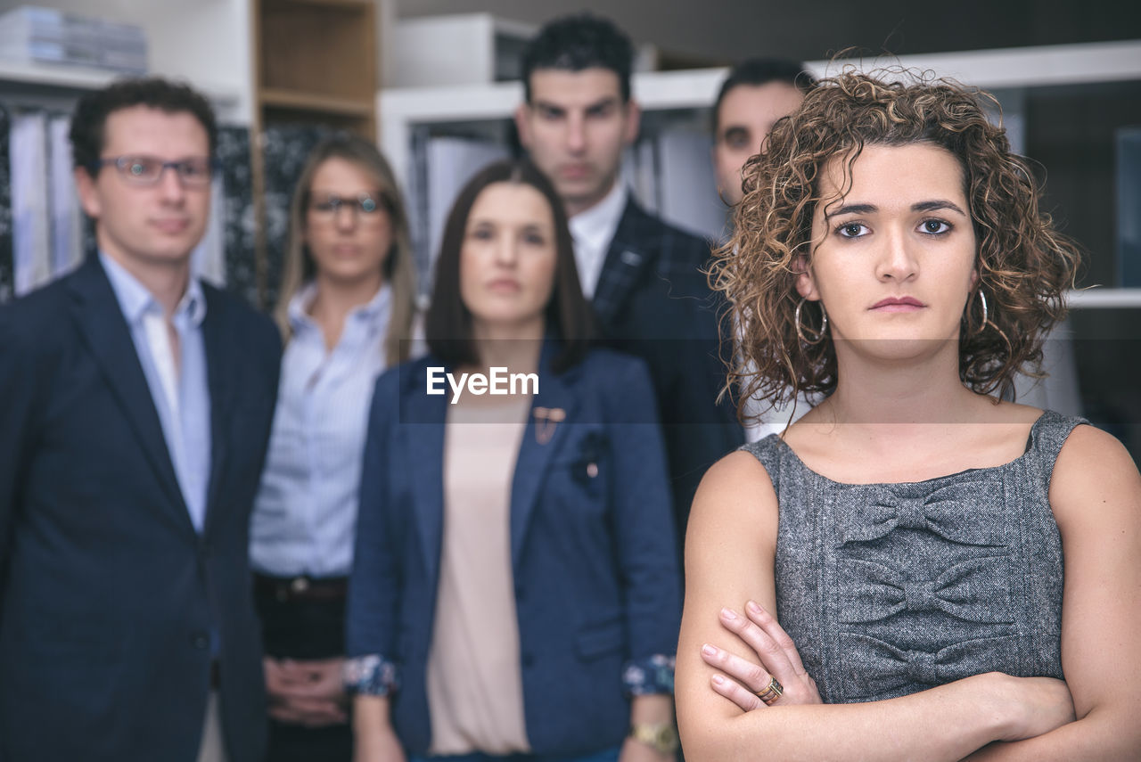 Portrait of business people standing in office