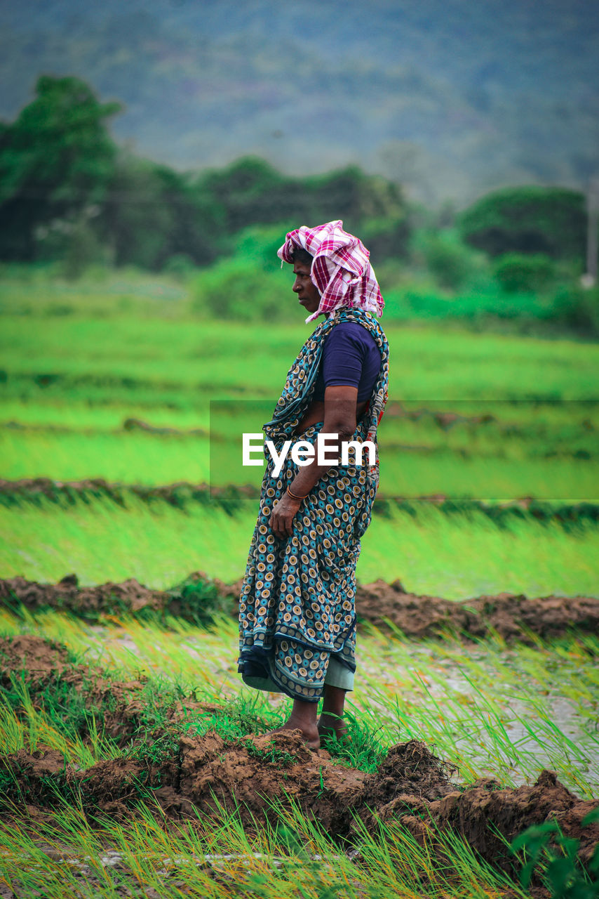 Woman standing on field