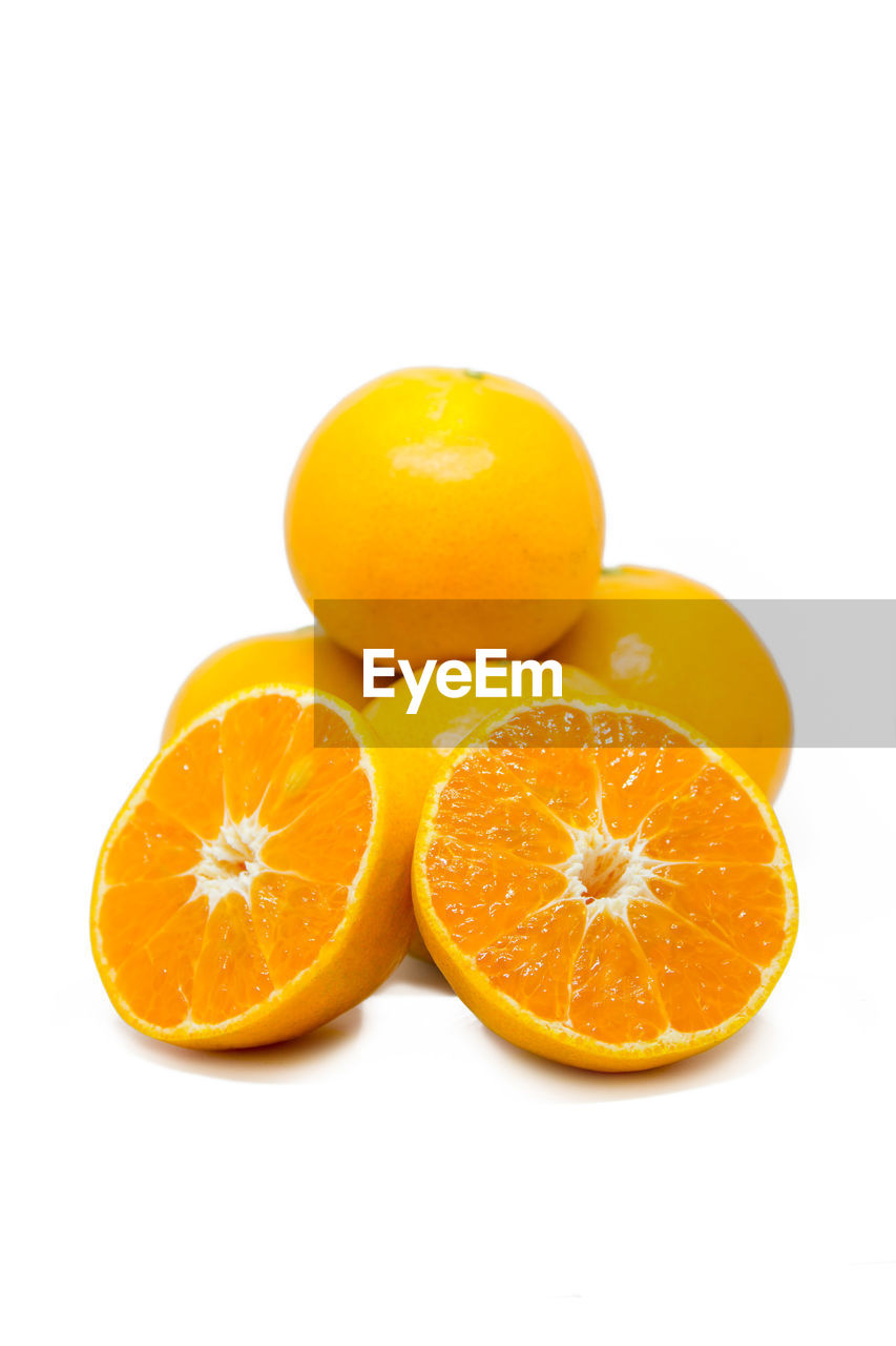 Close-up of oranges against white background