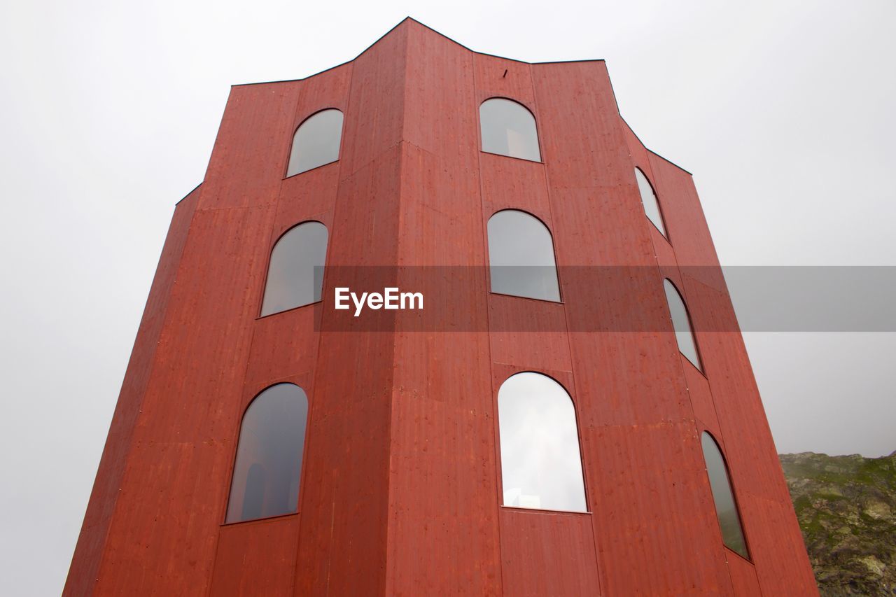 LOW ANGLE VIEW OF RED BUILDING AGAINST SKY