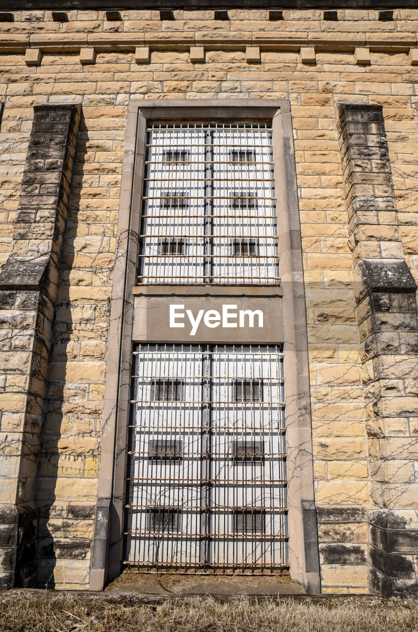 Abandoned prison brick wall and windows