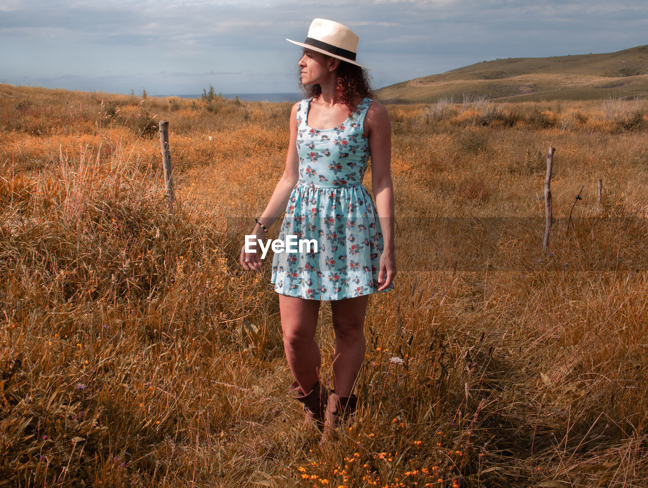 Full length of woman standing on field