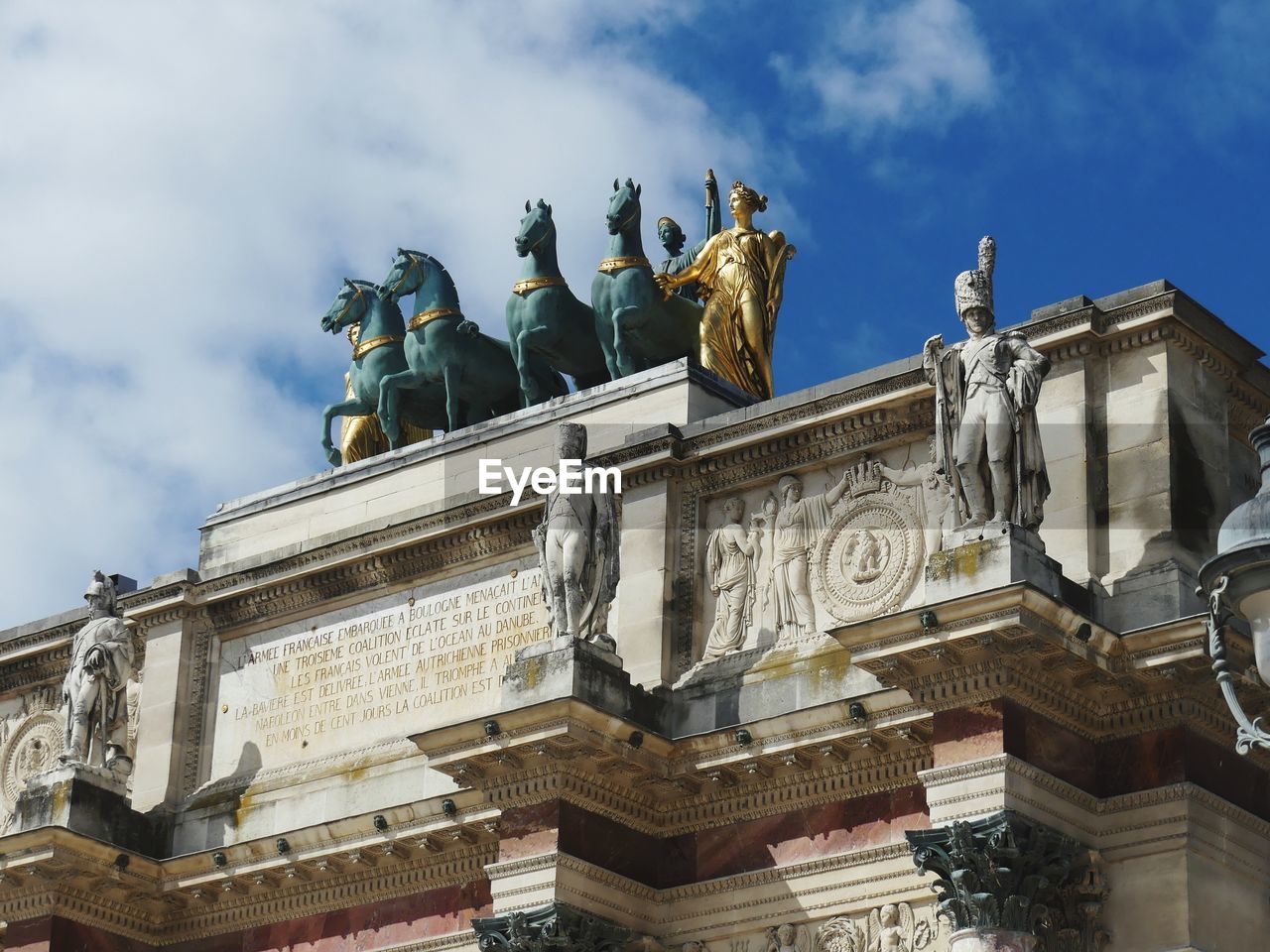 Low angle view of statue against sky