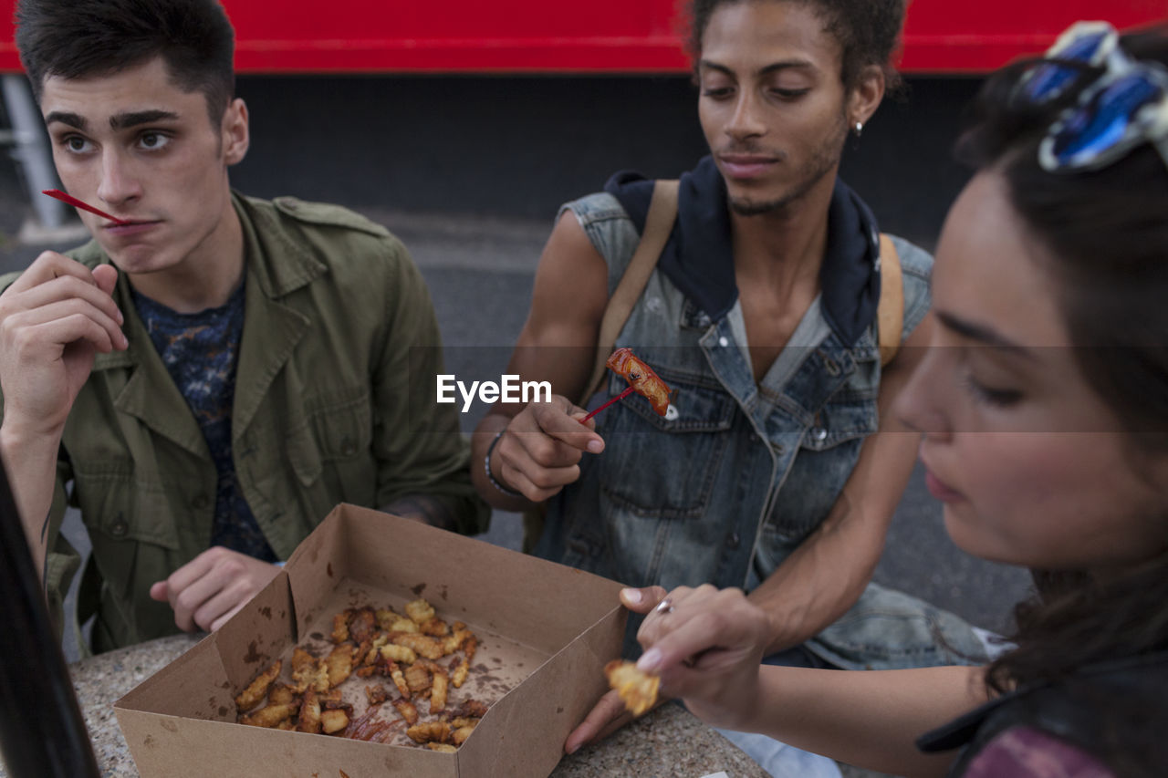 Friends enjoying fast food