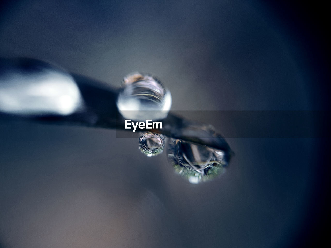 CLOSE-UP OF WATER DROP ON FINGER