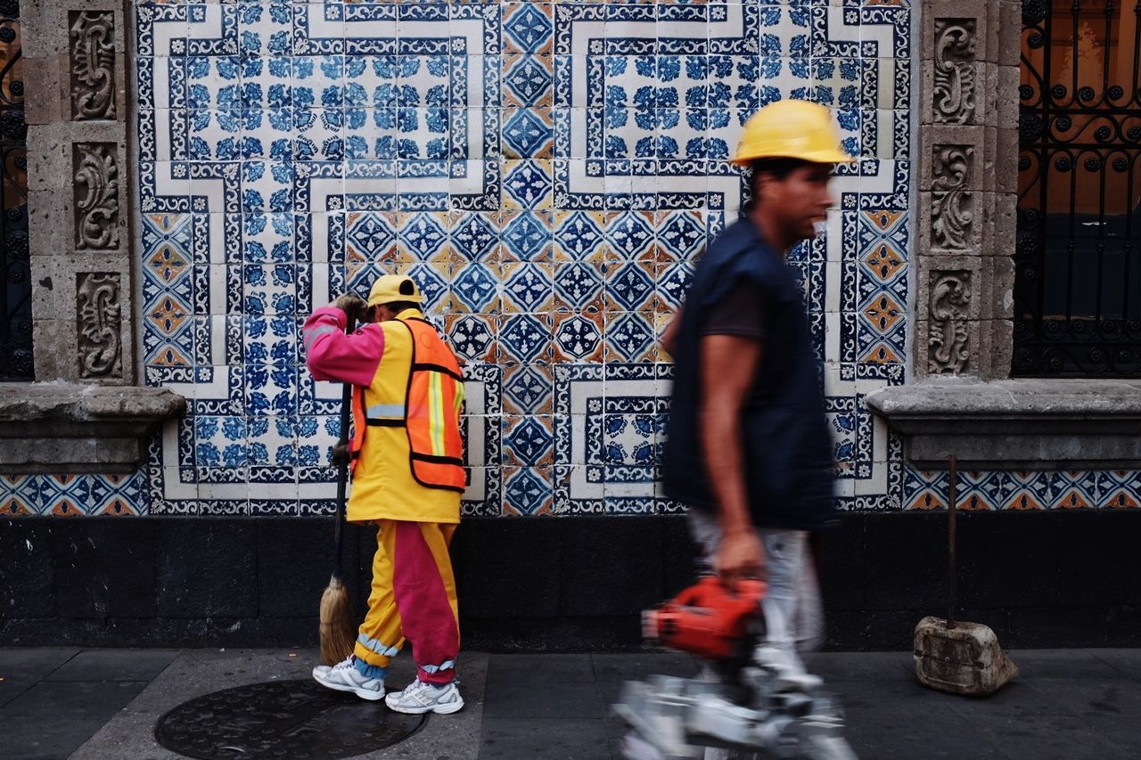 Construction workers working on sidewalk