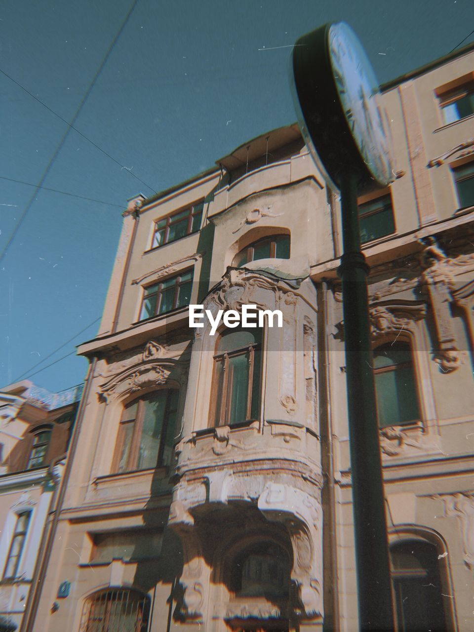 Low angle view of clock against building