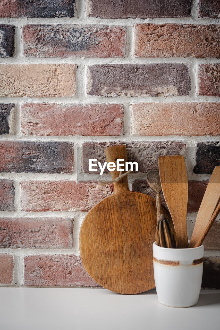 high angle view of wooden blocks on brick wall