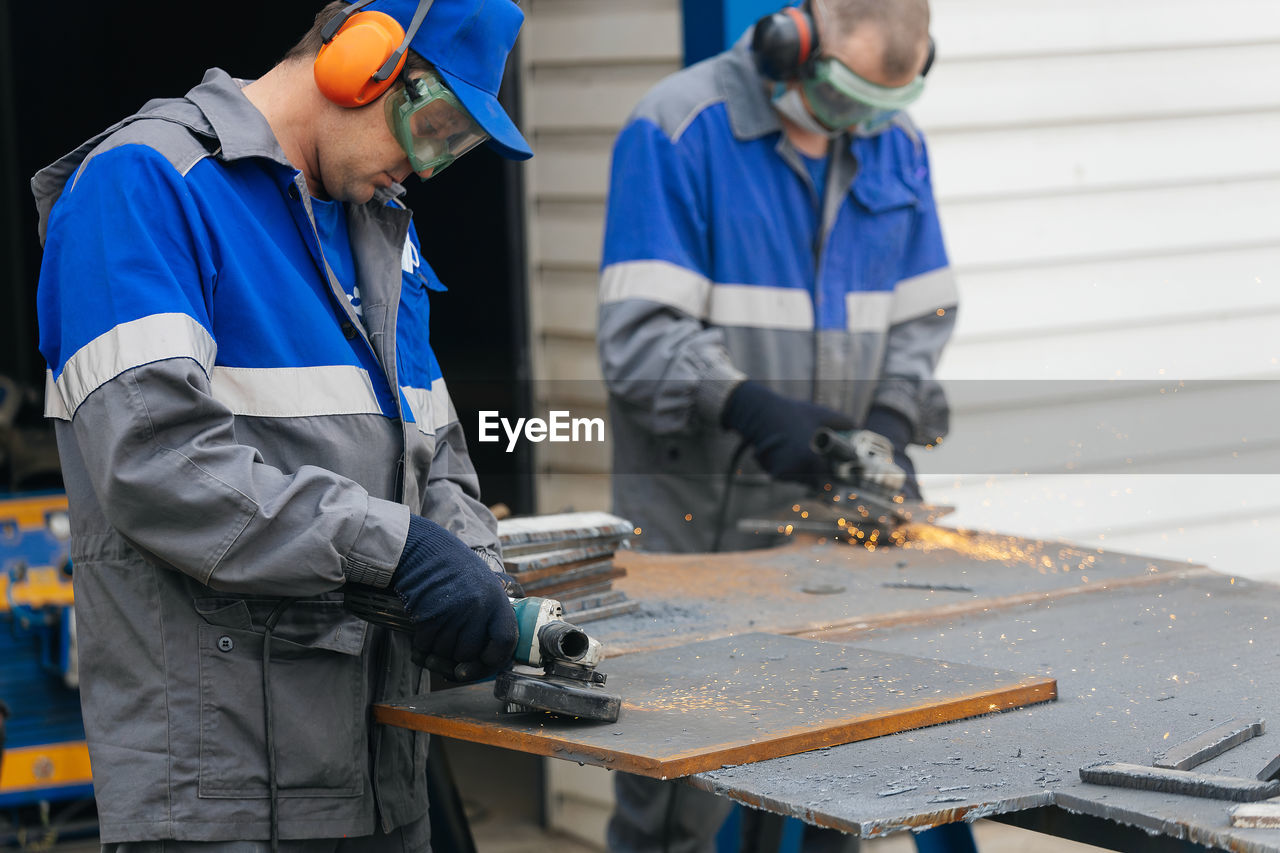 Rear view of man working at construction site