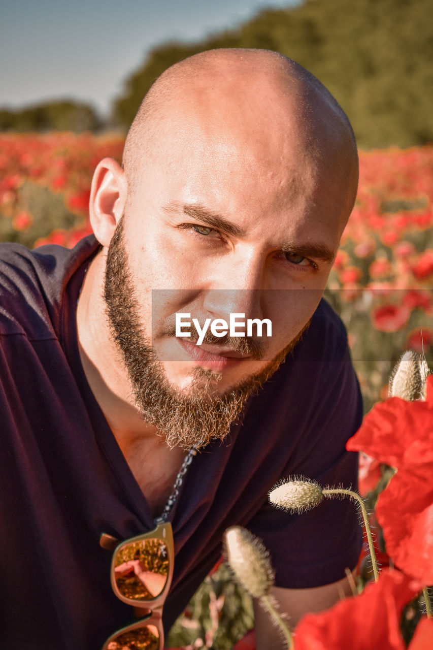 Close-up portrait of man wearing sunglasses