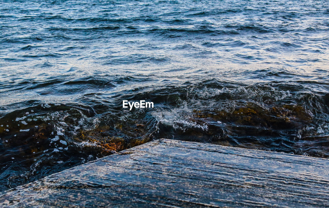 High angle view of water flowing over sea