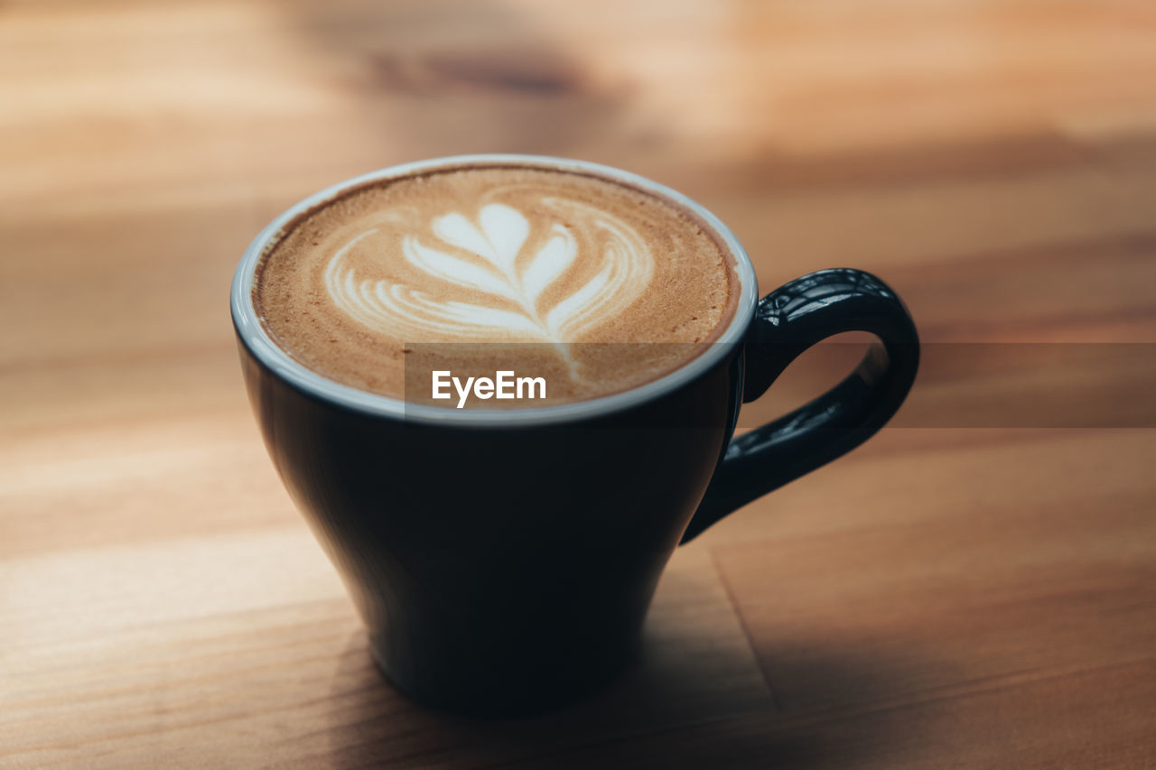 COFFEE CUP ON TABLE