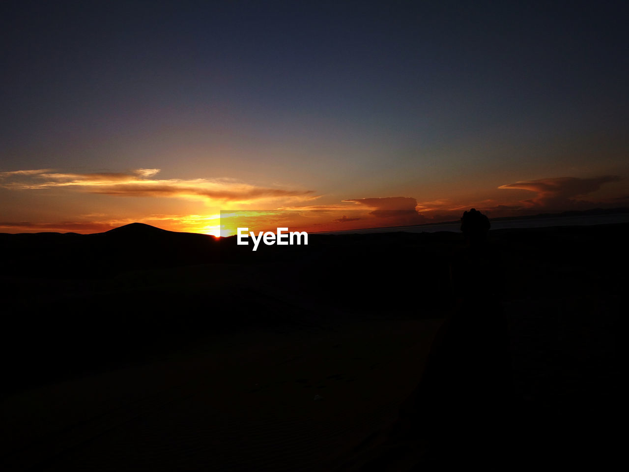 SILHOUETTE LANDSCAPE AT SUNSET