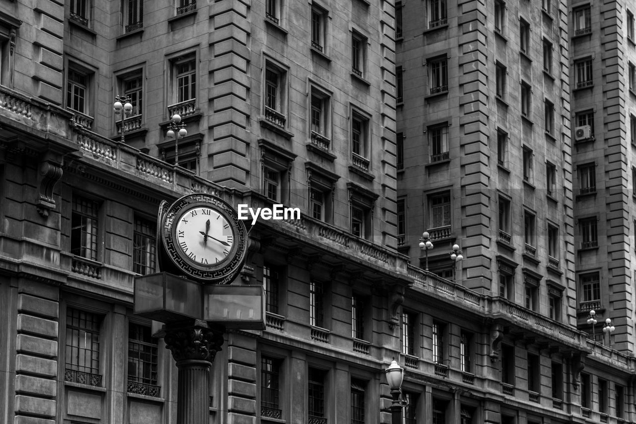 LOW ANGLE VIEW OF CLOCK AT NIGHT