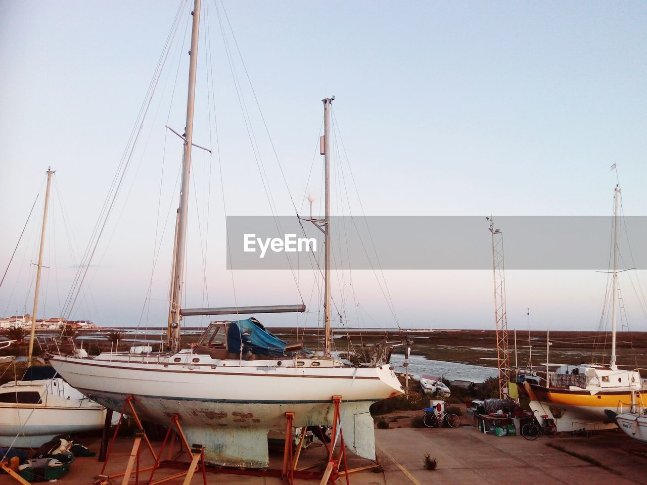 BOATS MOORED IN HARBOR