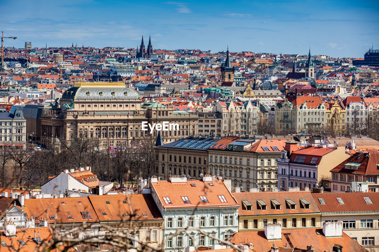 National theatre building and prague city old town seen from petrin hill in an early spring day