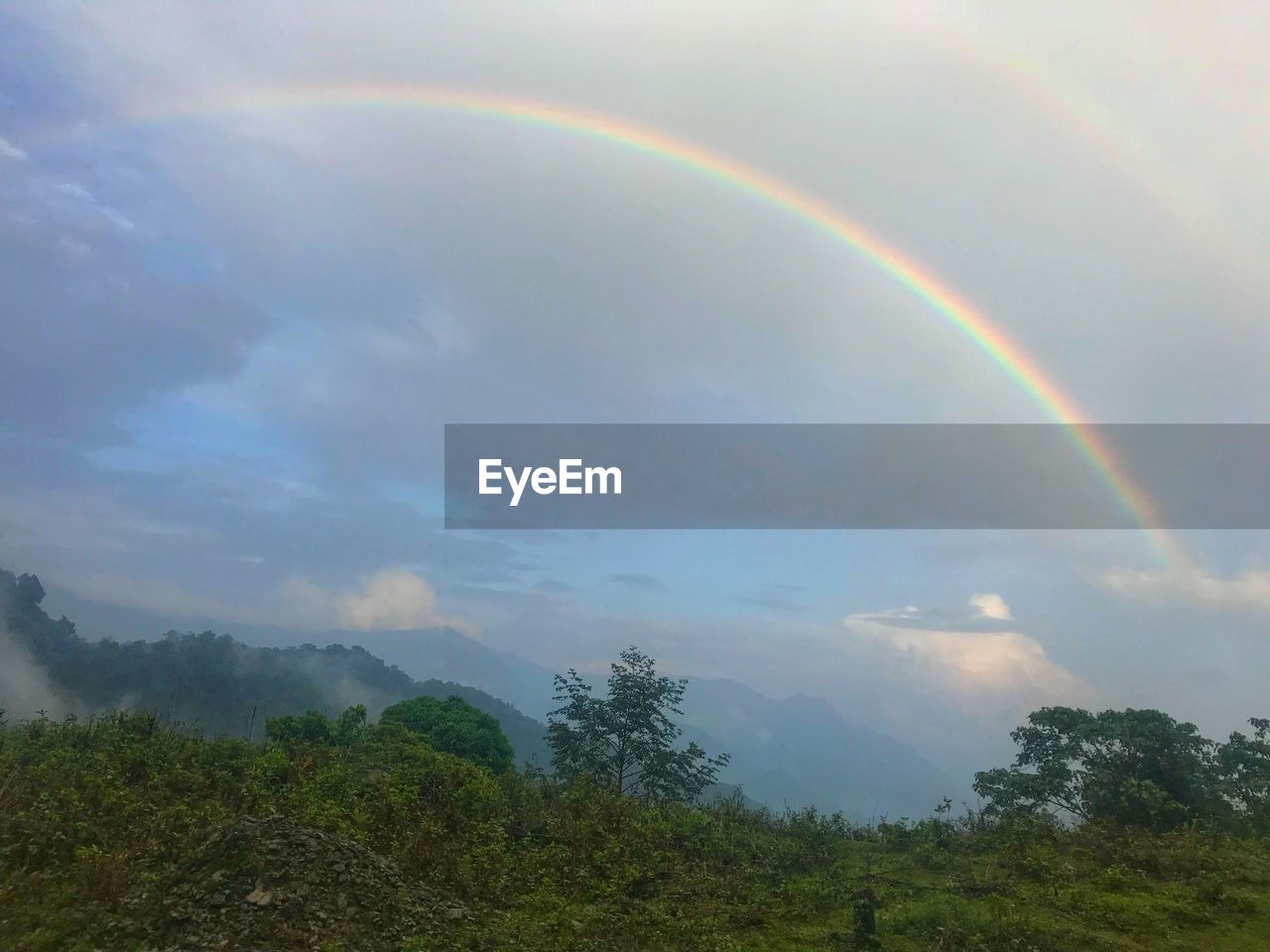 SCENIC VIEW OF RAINBOW IN SKY