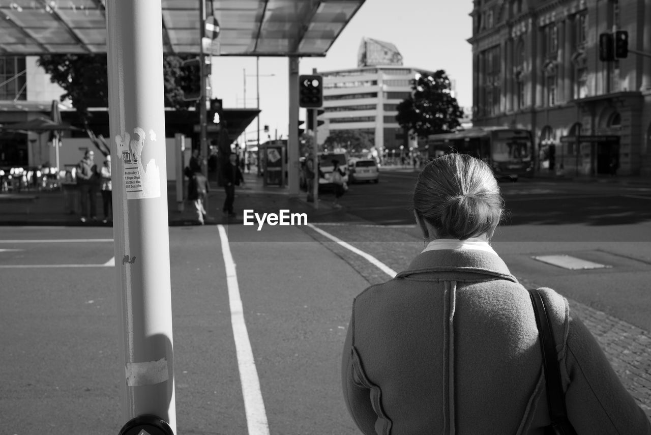 Woman walking on city street