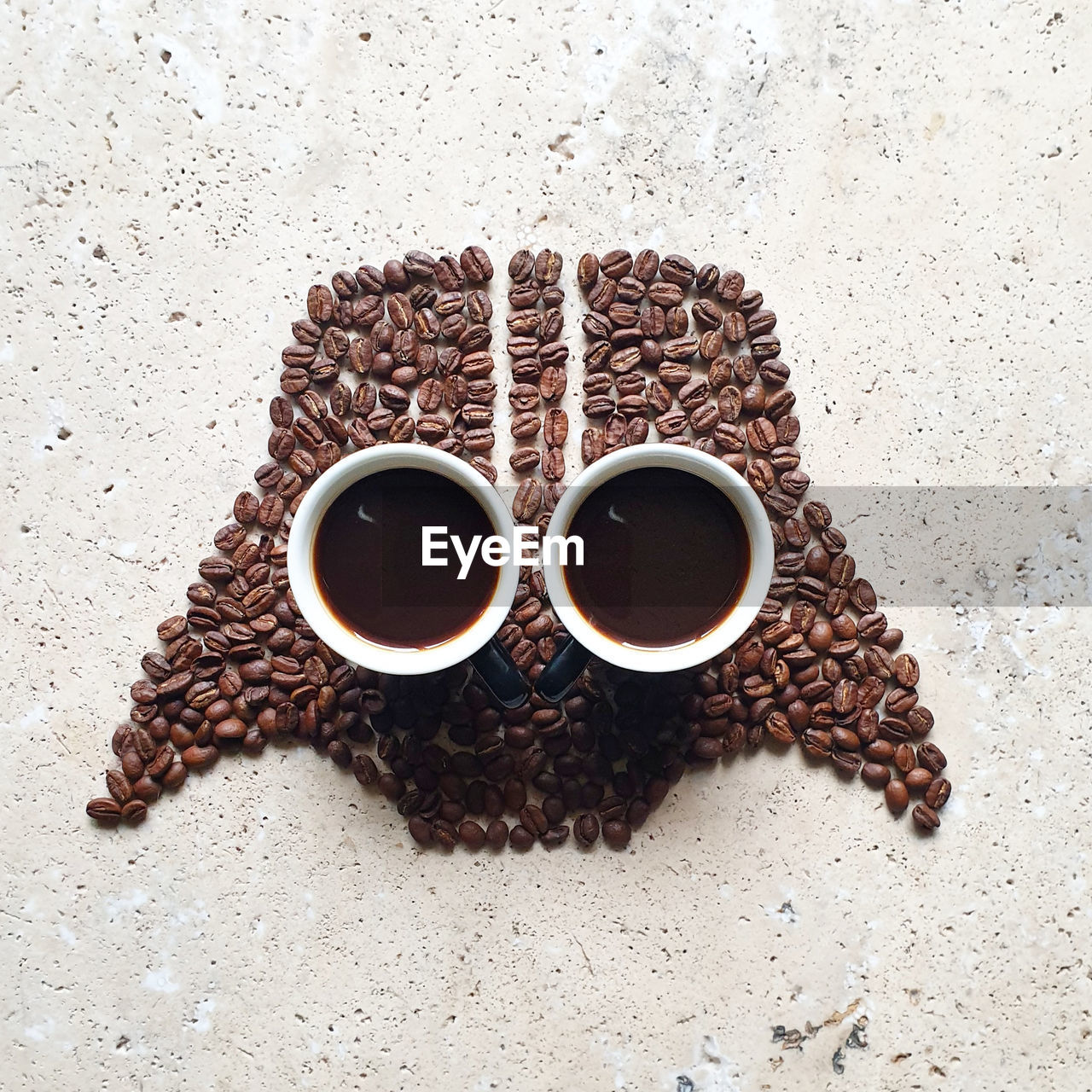 HIGH ANGLE VIEW OF COFFEE SERVED ON TABLE AGAINST BLACK BACKGROUND