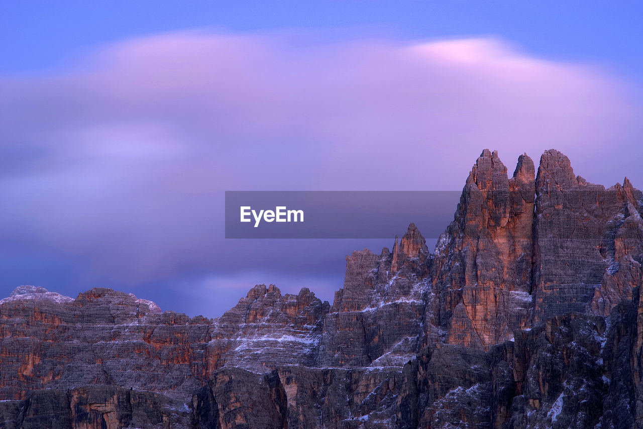 Rock formations on mountain against sky