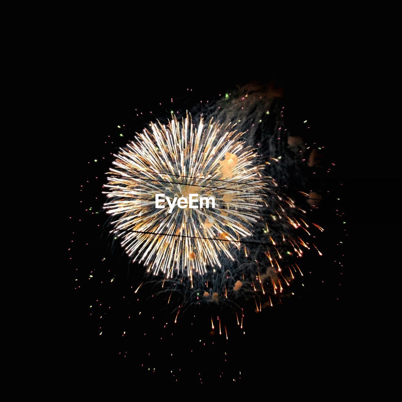 LOW ANGLE VIEW OF FIREWORK DISPLAY AGAINST SKY AT NIGHT