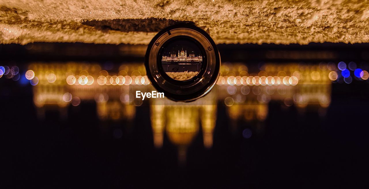 Upside down view of hungarian parliament through lens