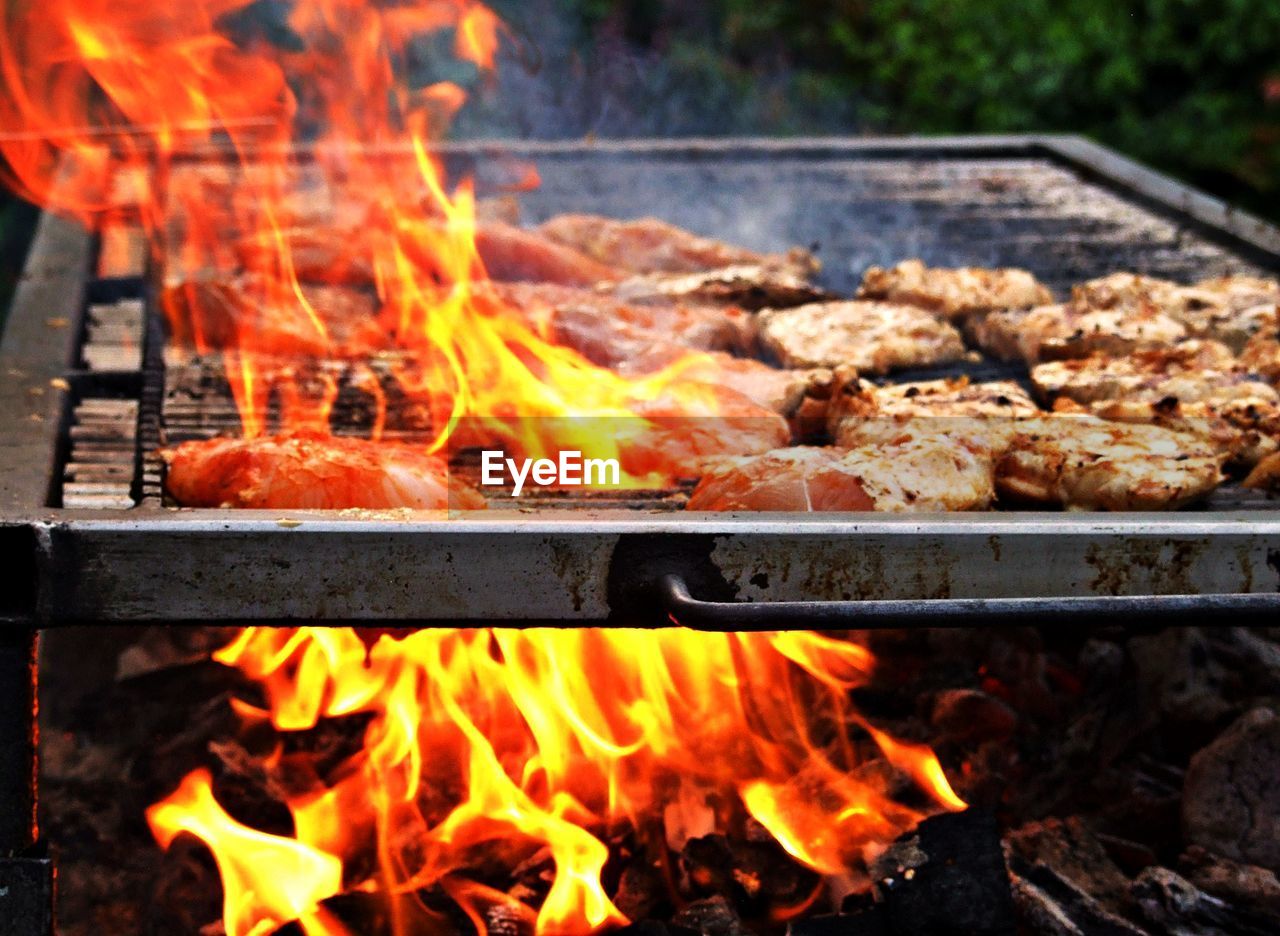 Close-up of meat on barbecue grill