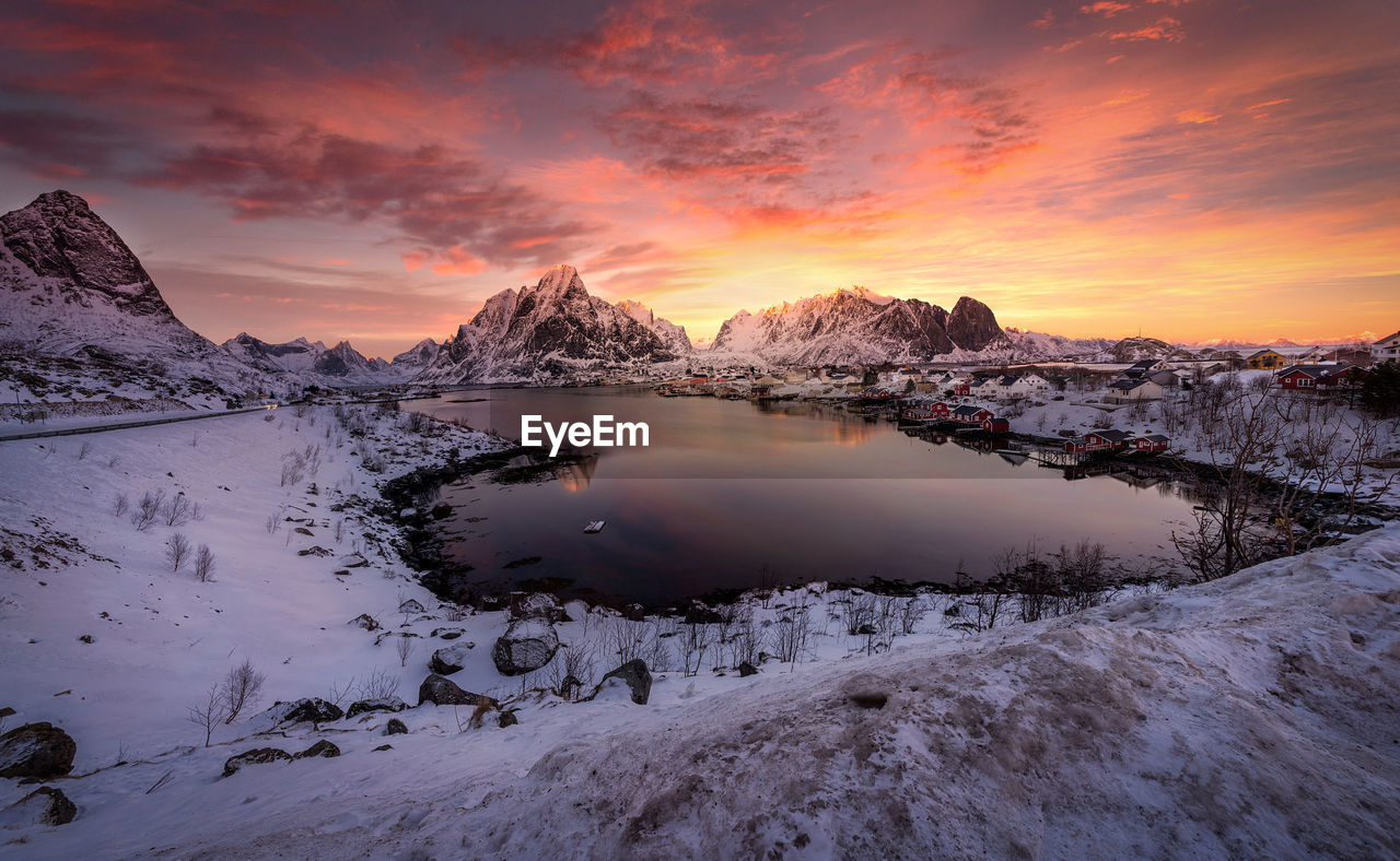 Scenic view of snowcapped mountains against sky during sunset