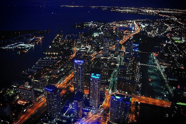 HIGH ANGLE VIEW OF CITY AT NIGHT