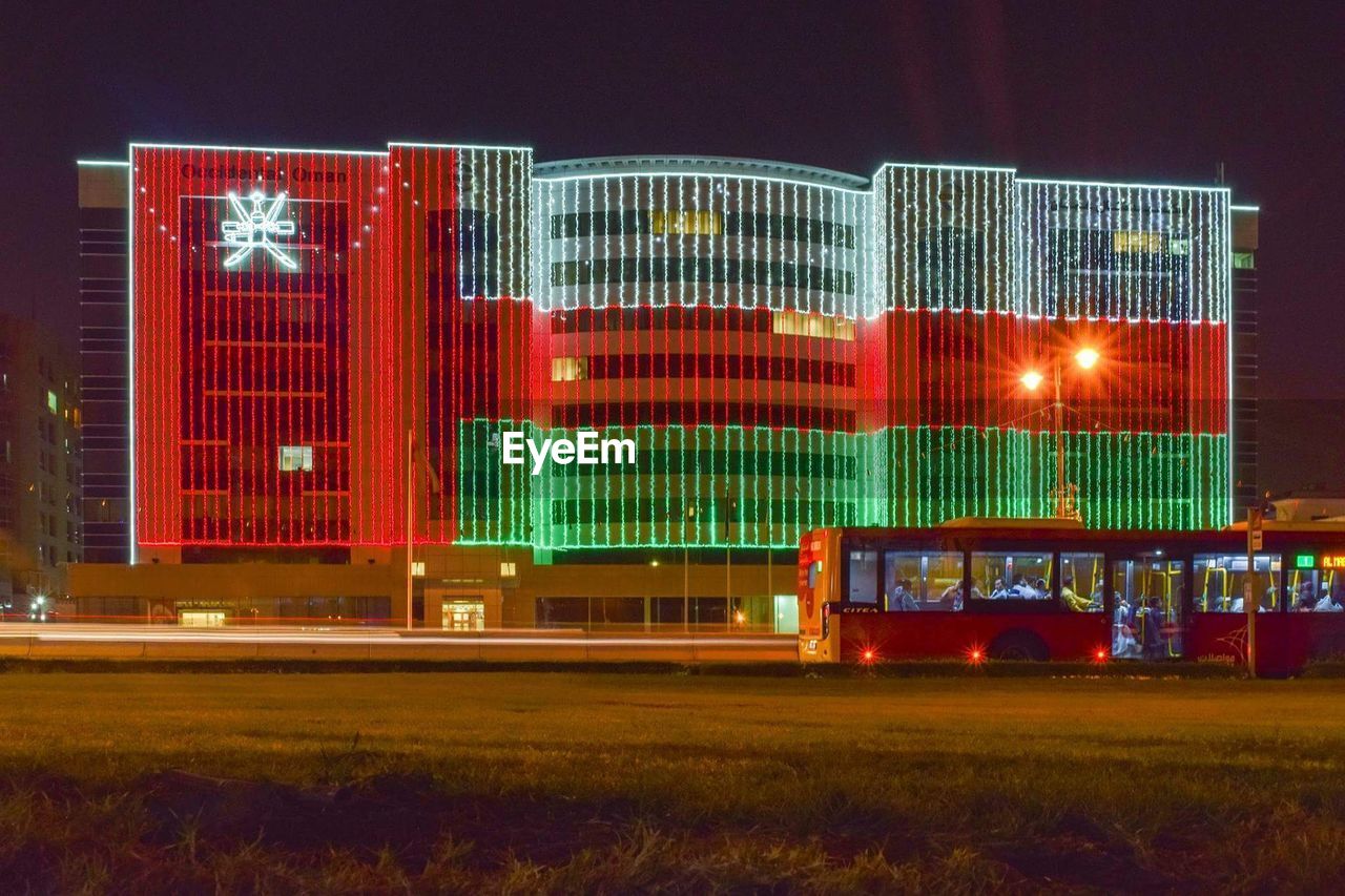 ILLUMINATED MODERN BUILDING AT NIGHT