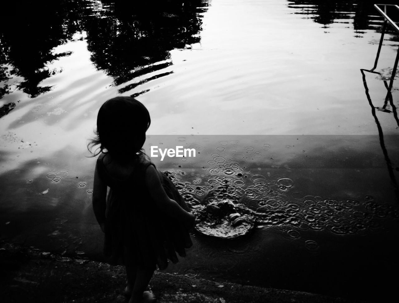 High angle view of silhouette girl in riverbank