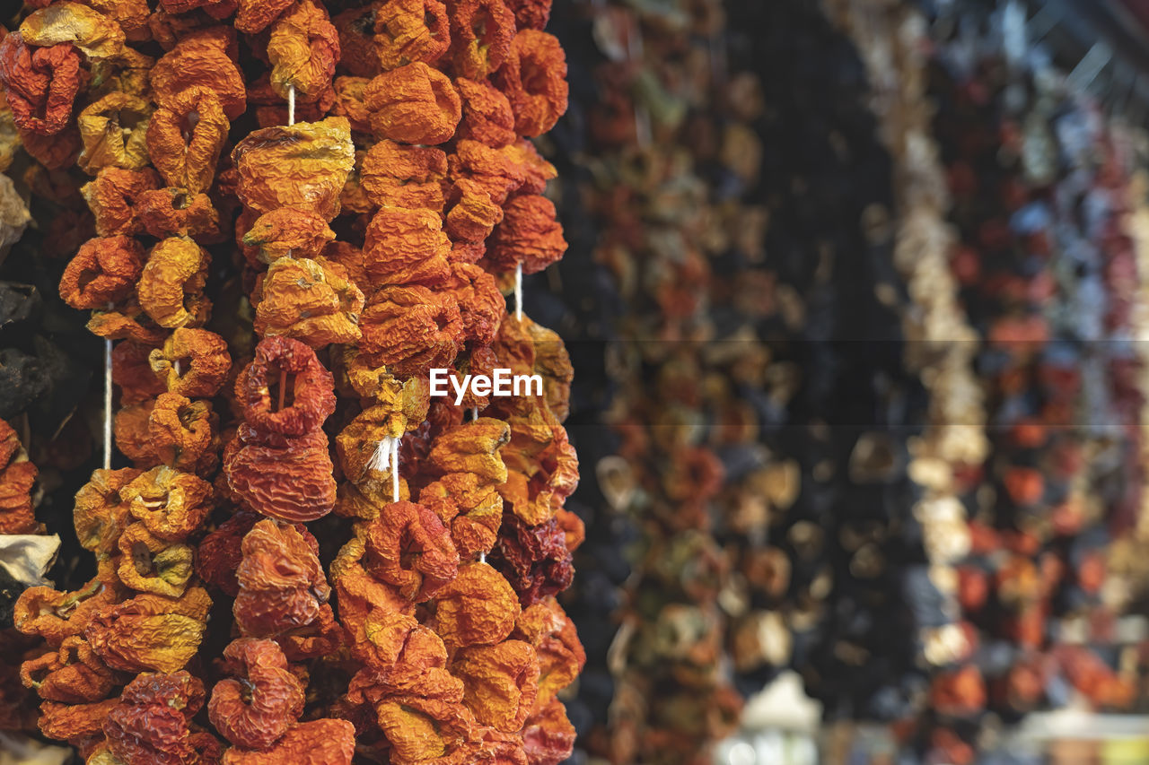 Dried vegetables hanging vertical in istanbul s egyptian  bazaar selective focus.