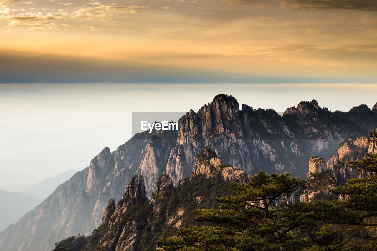 Scenic view of mountains against sky during sunset