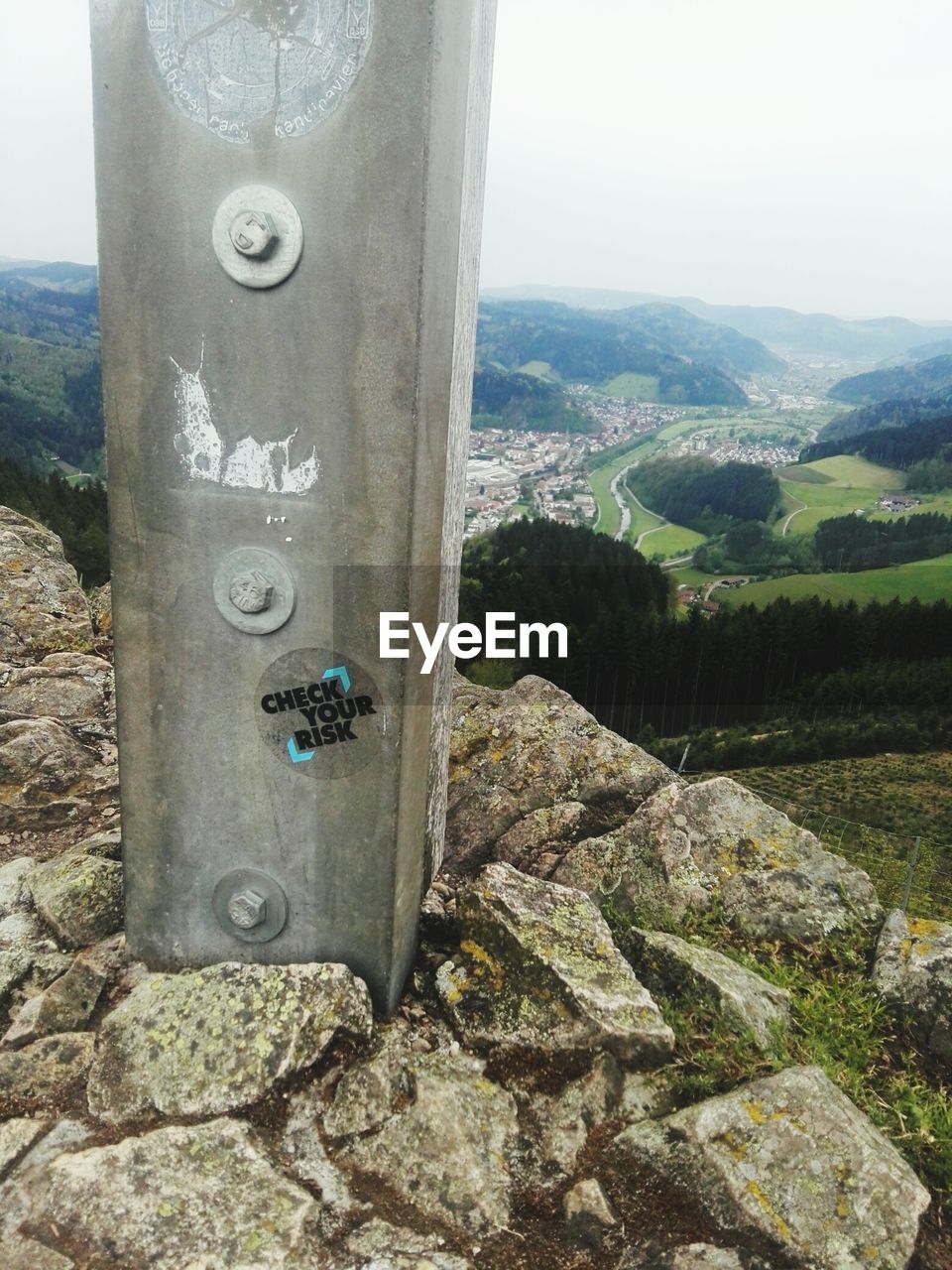 CLOSE-UP OF TEXT ON TREE AGAINST MOUNTAIN