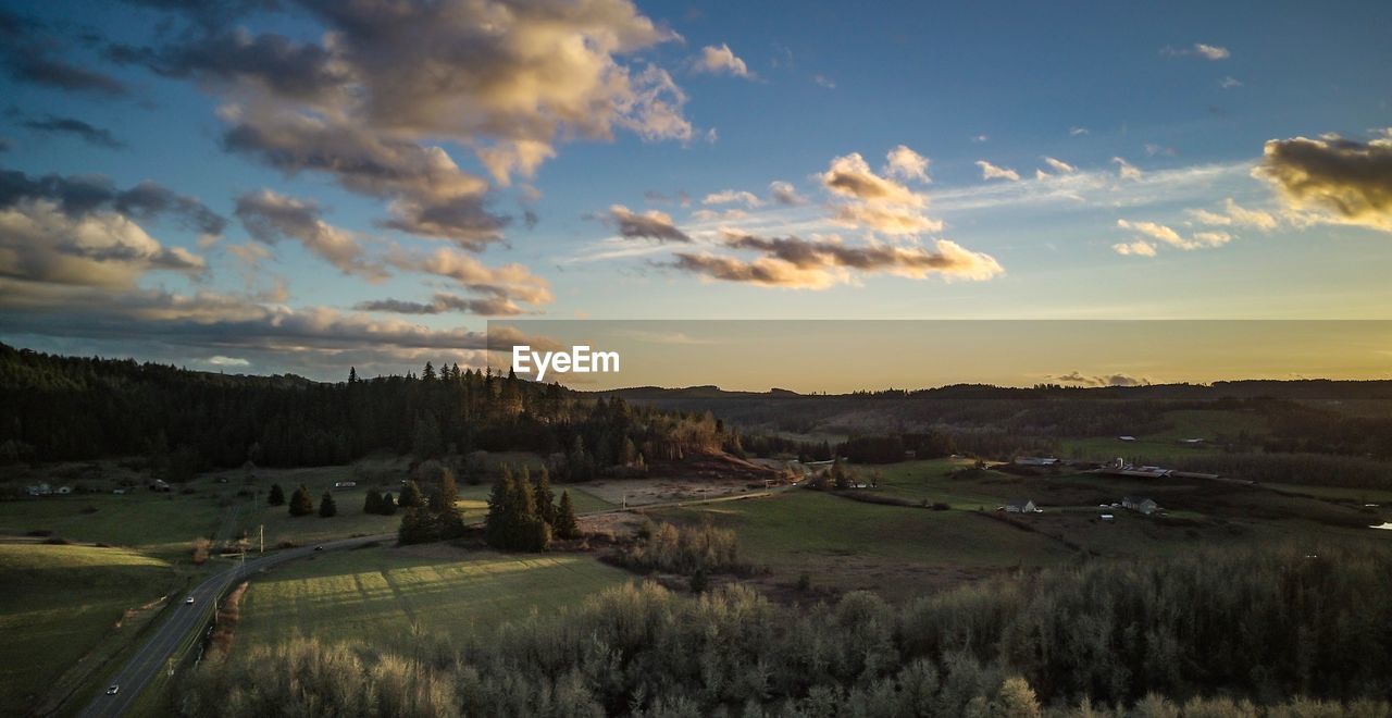 SCENIC VIEW OF LANDSCAPE AGAINST SKY DURING SUNSET