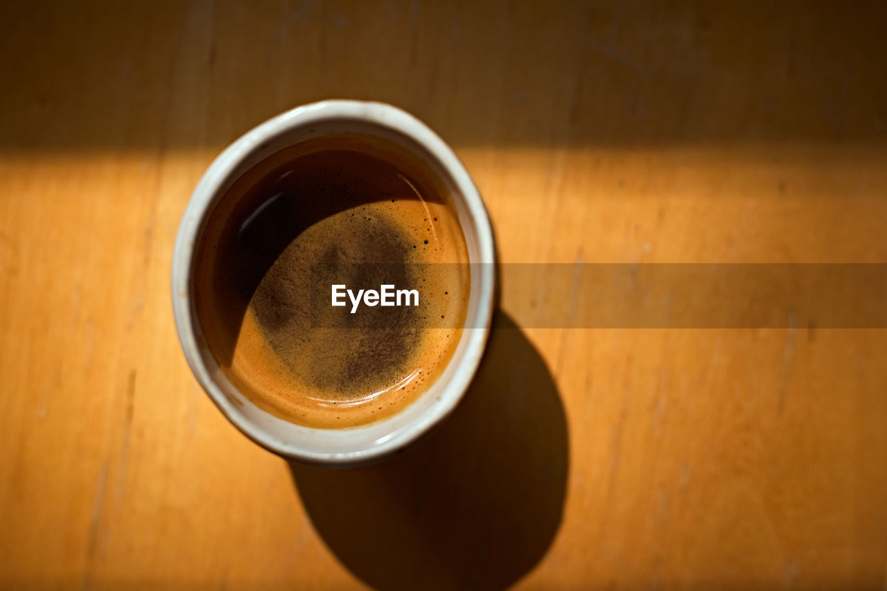 drink, refreshment, food and drink, cup, mug, wood, coffee, table, coffee cup, directly above, indoors, high angle view, still life, close-up, no people, brown, freshness, frothy drink, hot drink