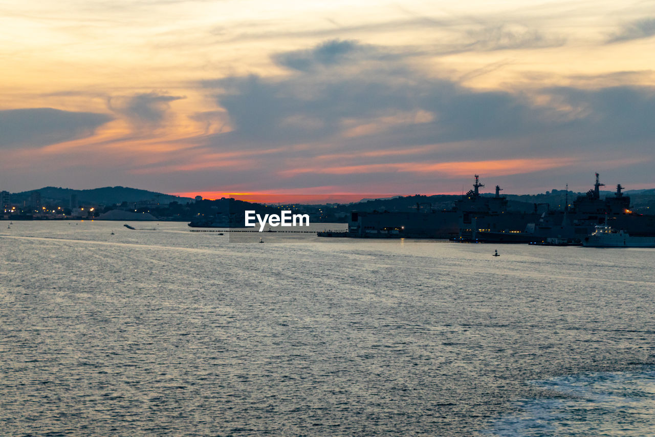 Scenic view of beach against sky during sunset