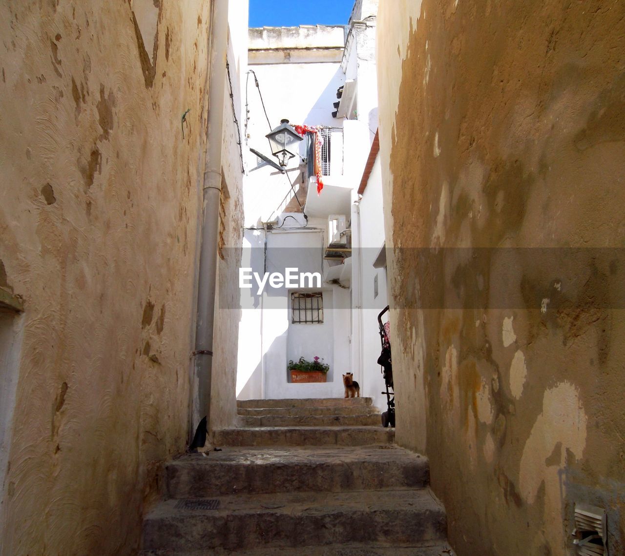 PEOPLE ON STAIRCASE IN CORRIDOR