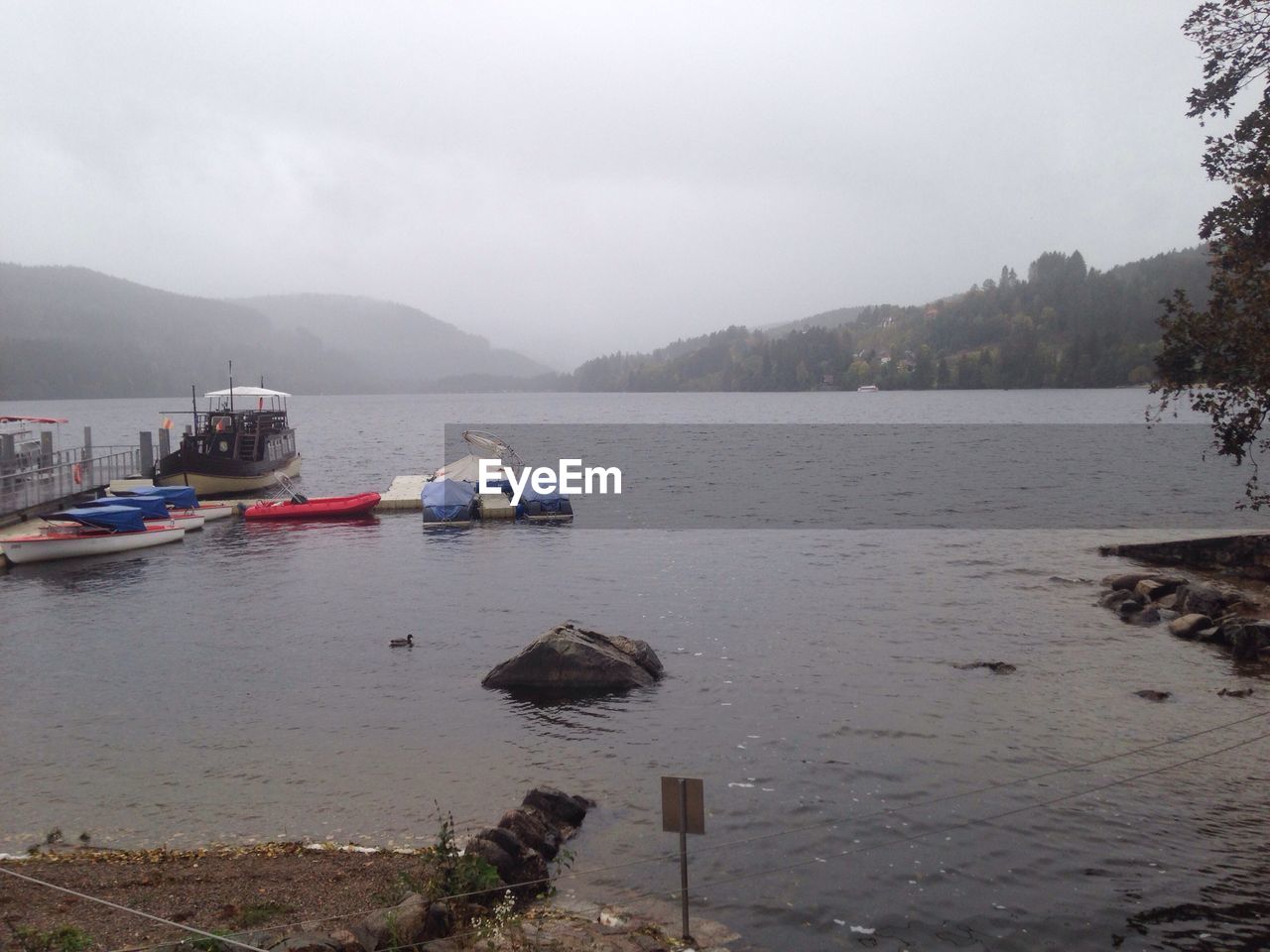 BOATS ON LAKE AGAINST SKY