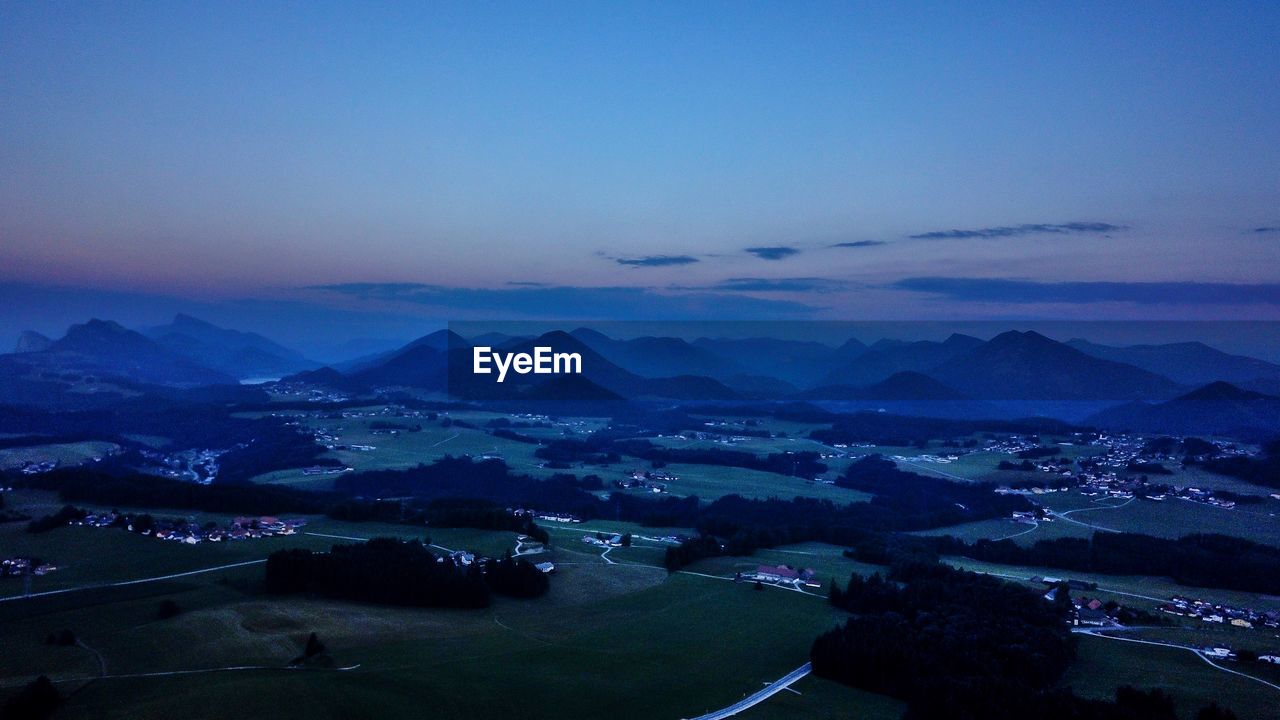 High angle view of city against sky at sunset