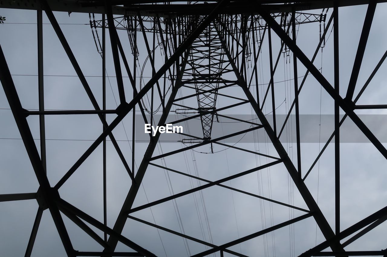 LOW ANGLE VIEW OF ELECTRICITY PYLON AGAINST CEILING