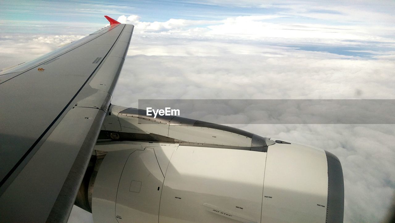 CROPPED IMAGE OF AIRPLANE WING