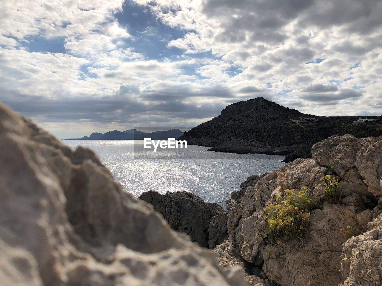 Scenic view of sea and rocks against sky